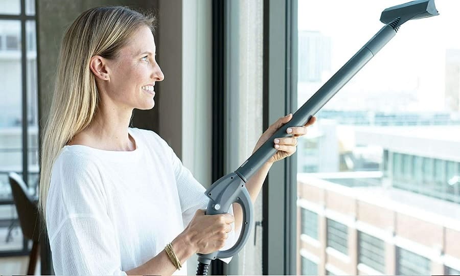 woman using vacuum for bed bug