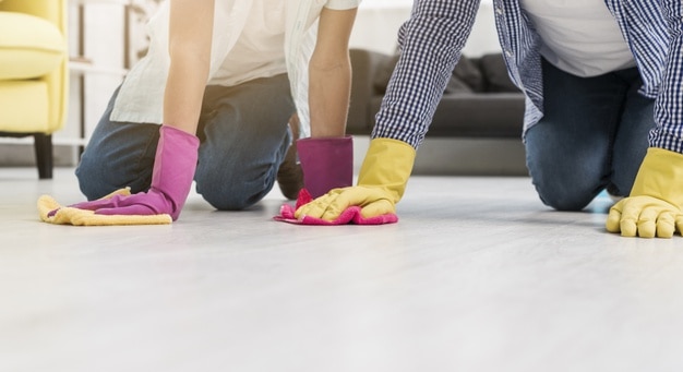 cleaning-floor-while-wearing-rubber-gloves