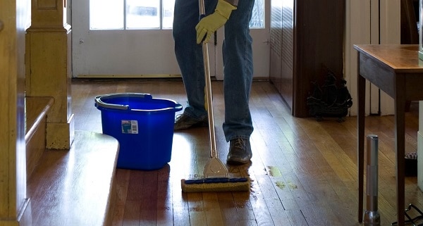 man cleaning the floor